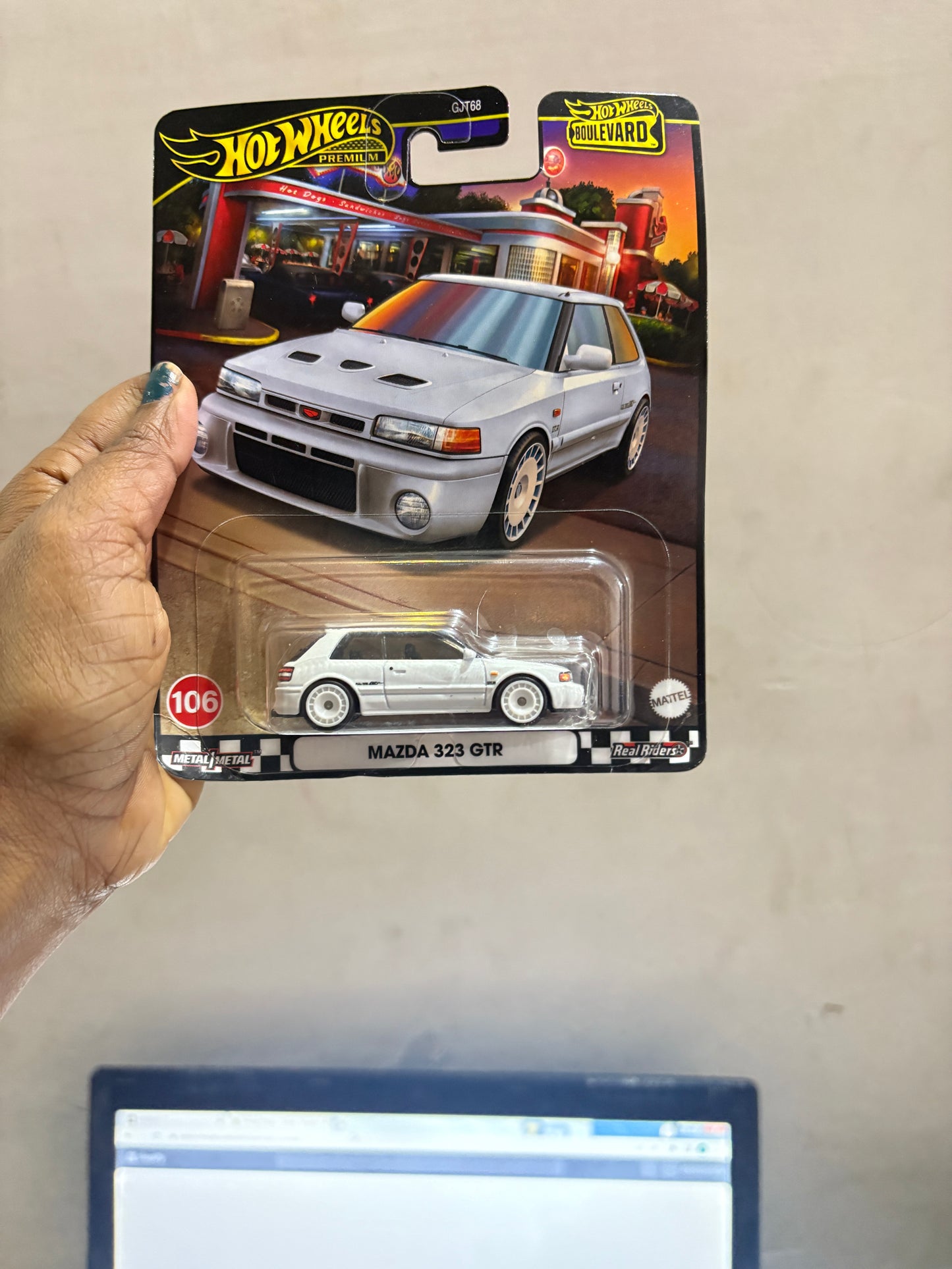 Hot Wheels Boulevard Mazda damage card 323 GTR 1:64 Scale Die-Cast Car, White