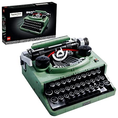 LEGO Ideas Typewriter 21327 set with 2,079 pieces, showcasing a functional typewriter model with moving keys, carriage, and platen roller.