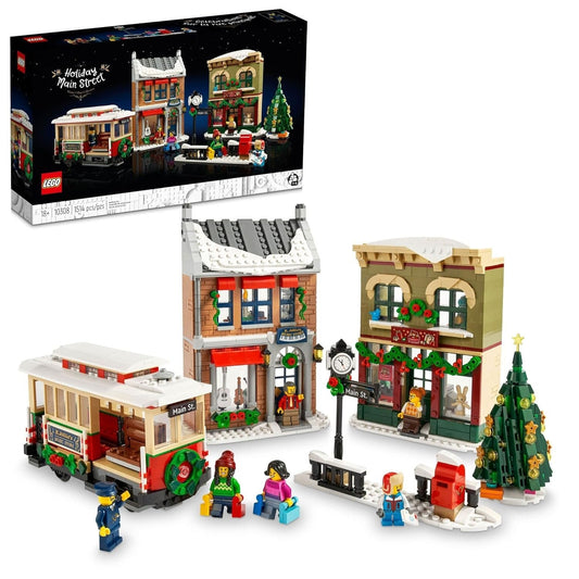 LEGO Icons 10308 Holiday Main Street set featuring toy and music shops, festive tram, Christmas tree, and 6 minifigures in a winter village setting.​
