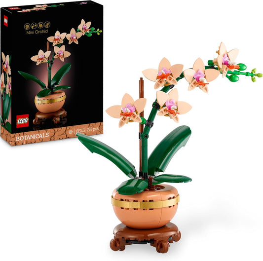 LEGO Botanicals Mini Orchid Set 10343, a 274-piece floral display featuring peach-colored blooms, buds, green leaves, and a terracotta pot with a wood-effect plinth, designed for builders aged 18 and up.