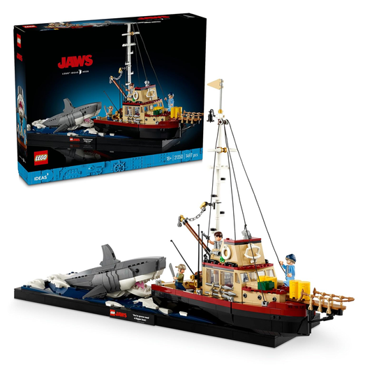 LEGO Ideas 21350 Jaws diorama featuring the Orca boat, attacking shark, and minifigures of Chief Brody, Matt Hooper, and Sam Quint.​